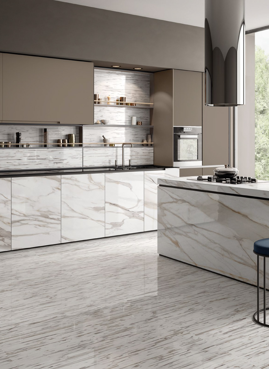 Wall/Floor: Doghe Calacatta Gold Canova 120x240 Table: Calacatta Gold Canova 120x240 Kitchen: Calacatta Gold Canova 59x118,2 Superfice Lappato Lucido o Naturale Gres Porcellanato Rettificato Tele di Marmo Reloaded Serie Emilceramica Piastrelle & Mosaici